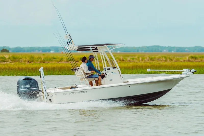 Slide: The Image of Manufacturer Provided Image: 2025 Key West 230 Bay Reef boat cruising on a calm waterway. - 33