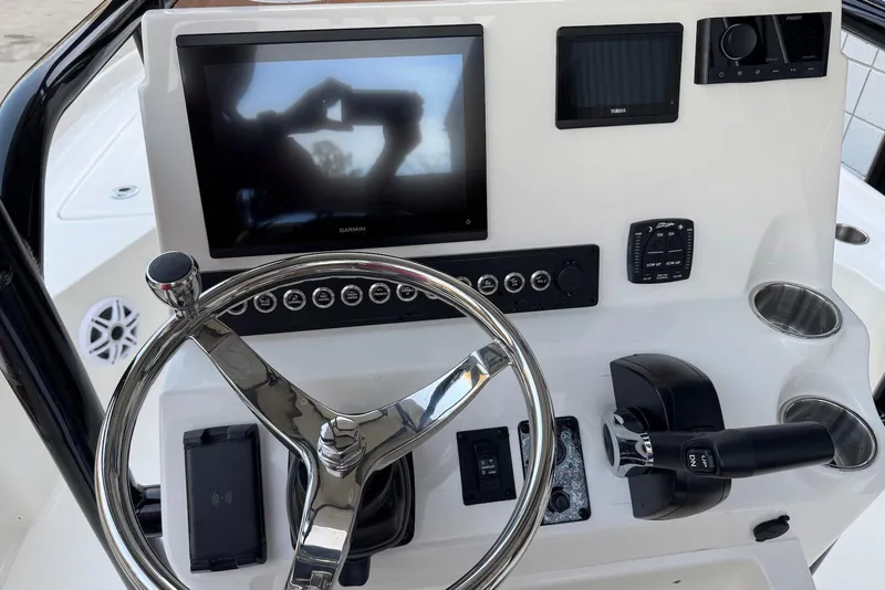 Slide: The Image of Steering console of 2026 Key West 230 Bay Reef with modern navigation equipment. - 8