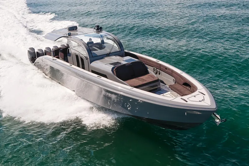 Slide: The Image of Luxury Midnight Express 52' Vitesse yacht cruising on open water, showcasing sleek design and power. - 1