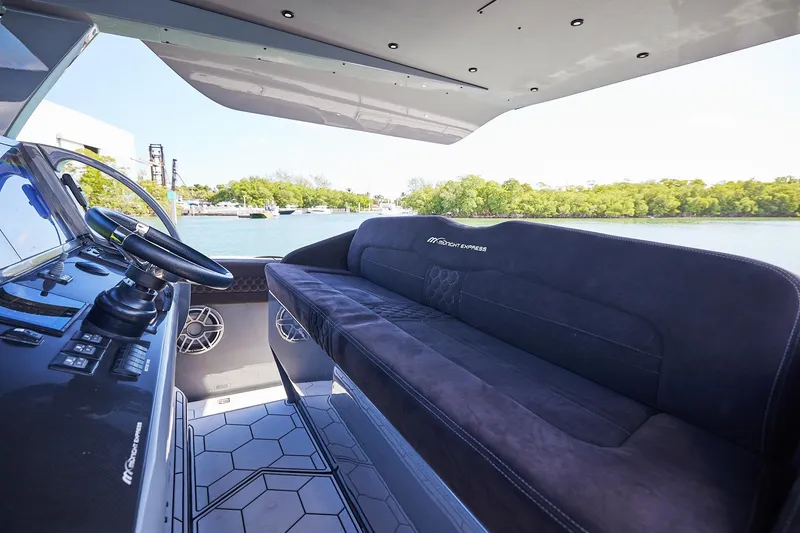 Slide: The Image of Luxurious interior of Midnight Express 52' Vitesse yacht with sleek seating and modern controls. - 11