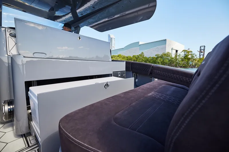 Slide: The Image of Luxury seating on a Midnight Express 52' Vitesse yacht, featuring sleek design and modern amenities. - 13