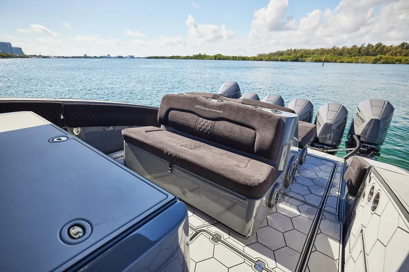 Slide: The Image of Luxury Midnight Express 52' Vitesse boat interior with multiple engines on a sunny day. - 14