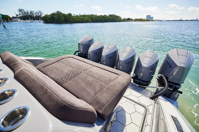 Slide: The Image of Luxury Midnight Express 52' Vitesse boat with five powerful outboard engines on a sunny day. - 16