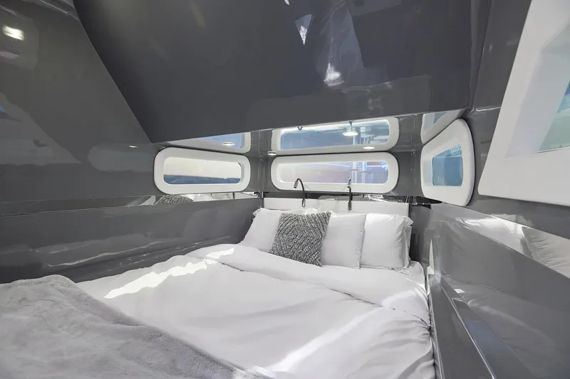 Slide: The Image of Luxurious cabin interior of Midnight Express 52' Vitesse yacht with modern bedding and sleek design. - 24