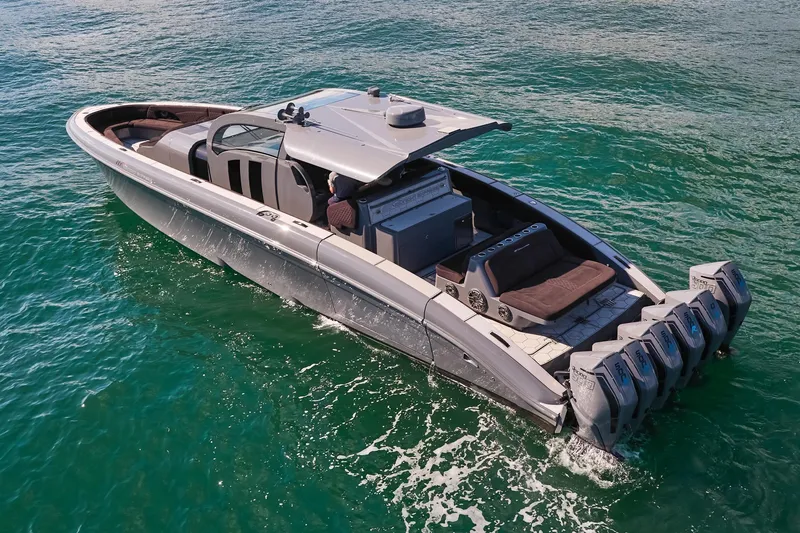 Slide: The Image of Luxurious Midnight Express 52' Vitesse boat cruising on clear blue water. - 4