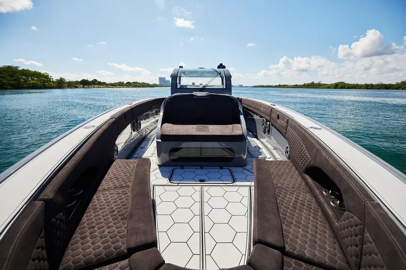 Slide: The Image of Luxurious Midnight Express 52' Vitesse yacht interior with plush seating on a sunny day. - 7