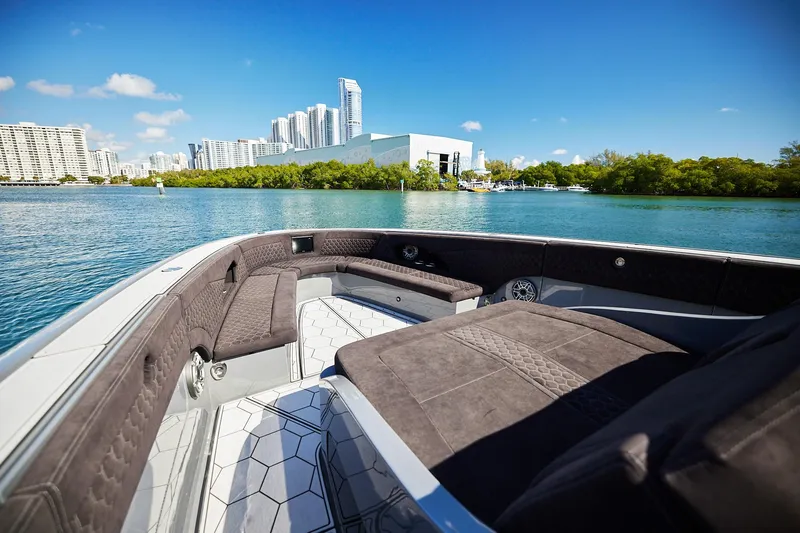 Slide: The Image of Luxurious Midnight Express 52' Vitesse boat interior with city skyline and waterfront view. - 9