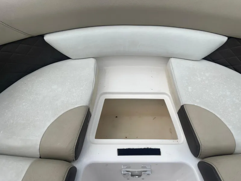 Slide: The Image of 2014 Regal 2700 Bowrider interior seating with storage compartment. - 10