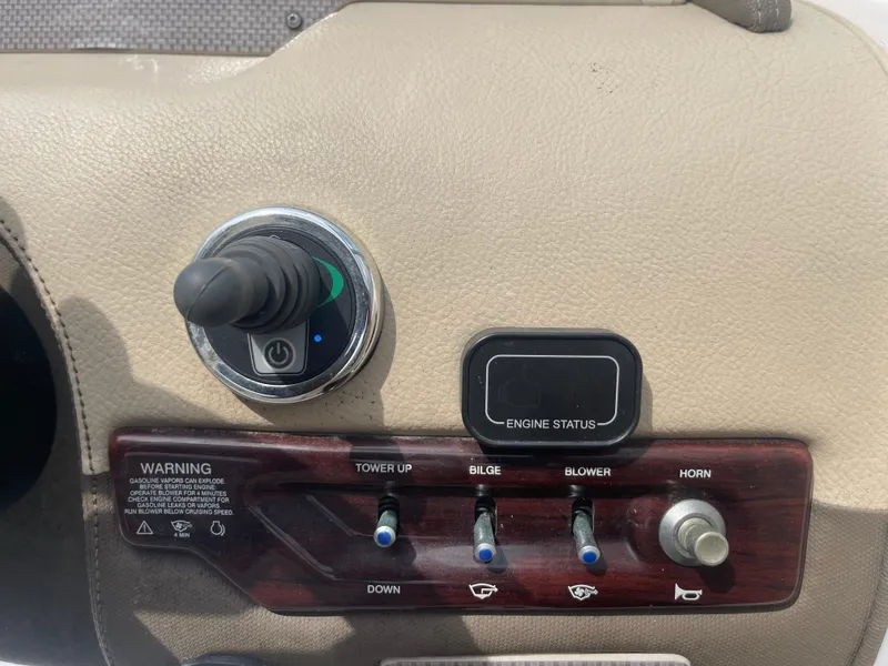 Slide: The Image of Control panel of 2014 Regal 2700 Bowrider boat with switches and engine status display. - 17