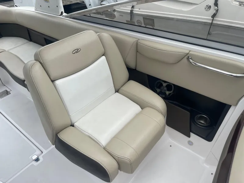 Slide: The Image of 2014 Regal 2700 Bowrider interior with beige and white seating. - 21