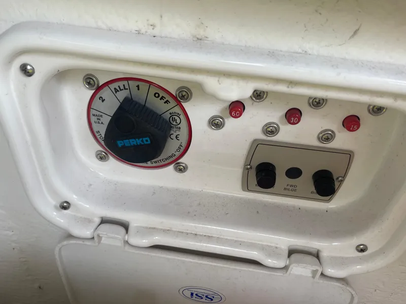 Slide: The Image of Control panel of a 2014 Regal 2700 Bowrider boat with Perko switch and indicators. - 37