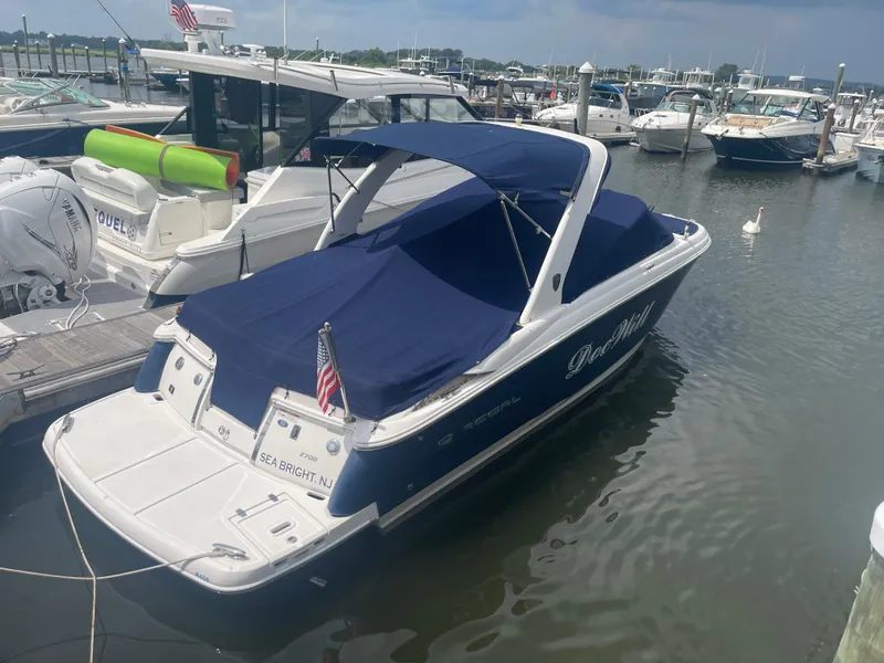 Slide: The Image of 2014 Regal 2700 Bowrider boat docked in marina, blue cover, Sea Bright, NJ. - 4
