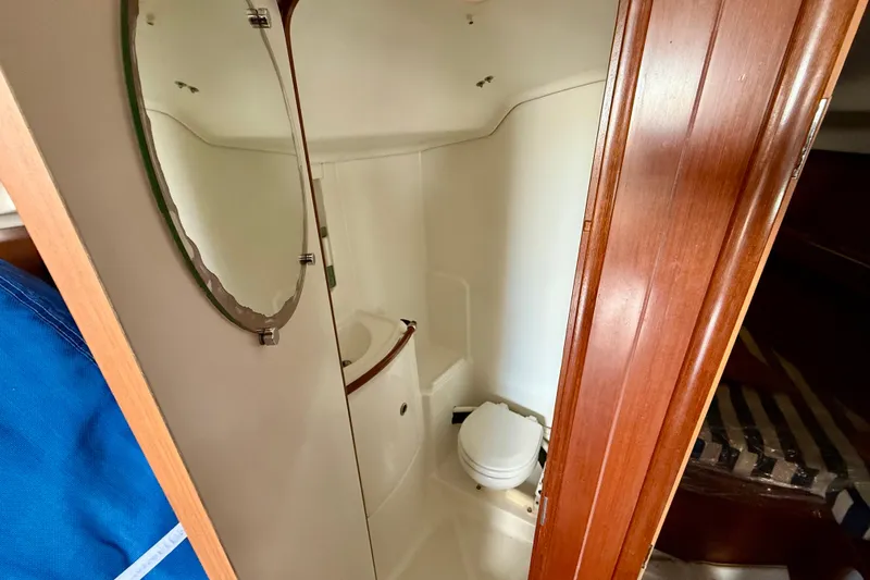 Slide: The Image of 2005 Beneteau First 36.7 yacht bathroom with mirror and toilet. - 18