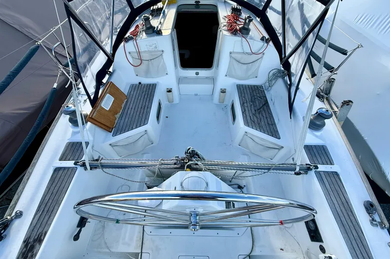 Slide: The Image of 2005 Beneteau First 36.7 sailboat cockpit with steering wheel and seating area. - 8