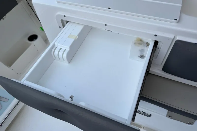 Slide: The Image of Open storage compartment on 2026 Key West 263 FS boat, showcasing interior design. - 11