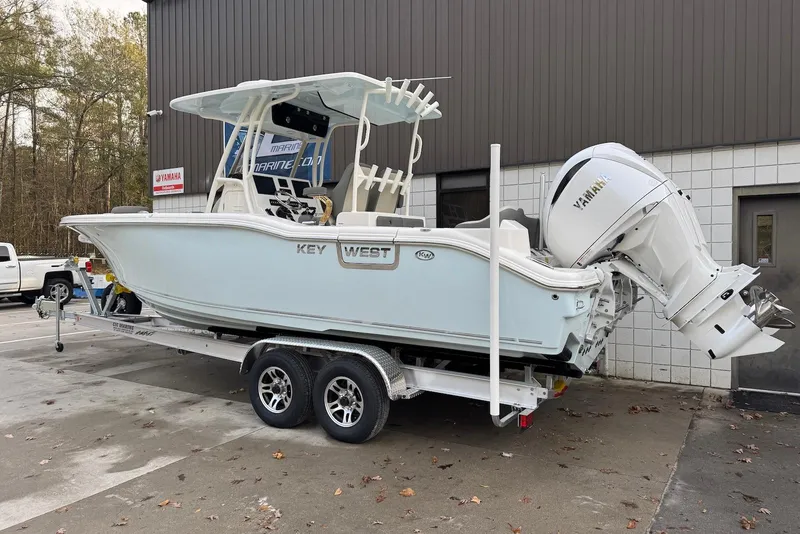 Slide: The Image of 2026 Key West 263 FS boat on trailer, featuring Yamaha outboard motor. - 2