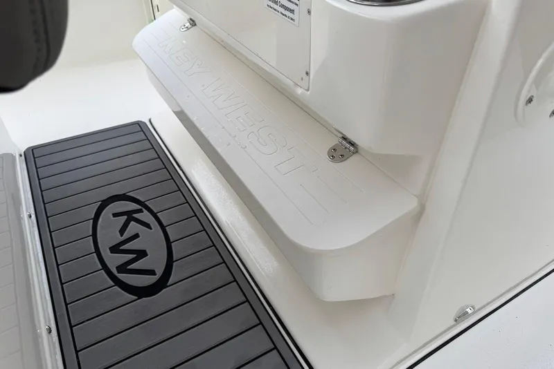 Slide: The Image of 2026 Key West 263 FS boat interior with branded step and mat. - 20