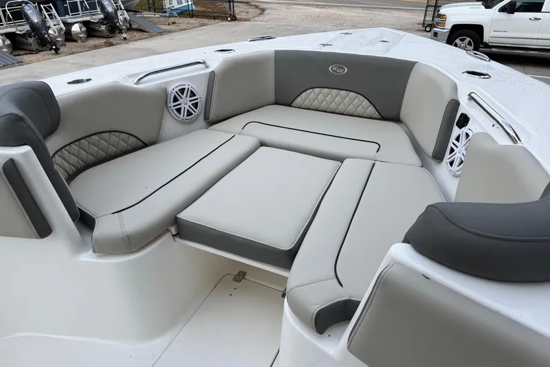 Slide: The Image of 2026 Key West 263 FS boat interior with cushioned seating and speakers. - 23
