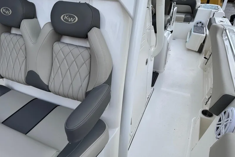 Slide: The Image of 2026 Key West 263 FS boat interior with cushioned seating and modern design. - 27
