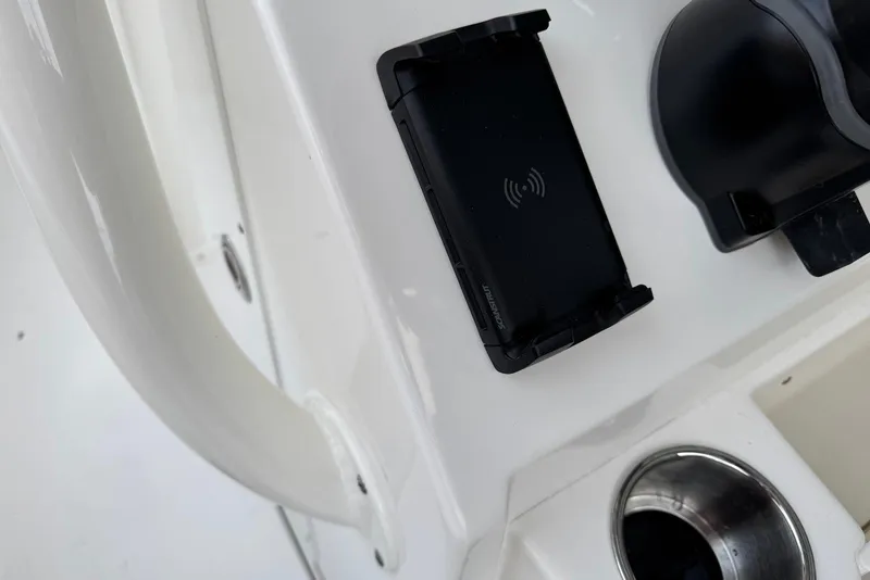 Slide: The Image of 2026 Key West 263 FS boat console with wireless charging pad and cup holder. - 29