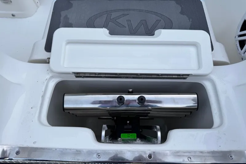 Slide: The Image of Open storage compartment on 2026 Key West 263 FS boat, featuring stainless steel components. - 40