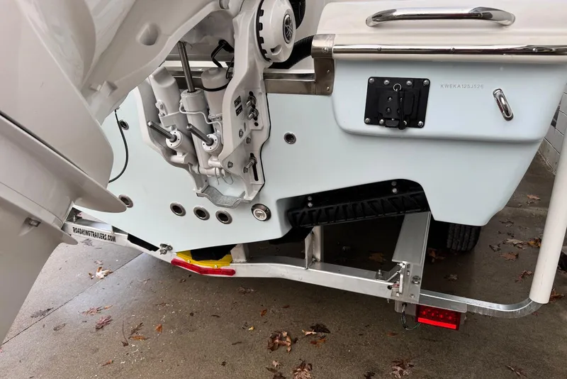 Slide: The Image of 2026 Key West 263 FS boat on trailer, showcasing engine and hull details. - 5