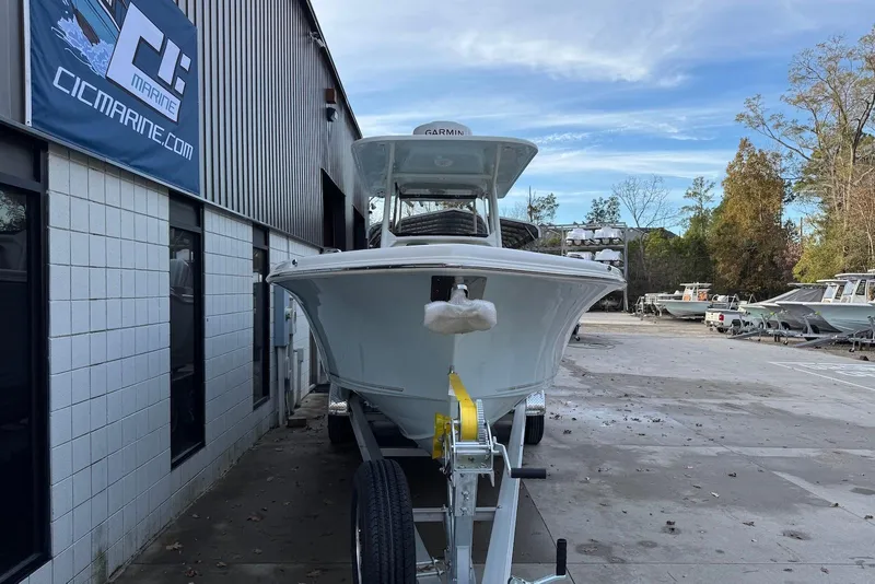 Slide: The Image of 2026 Key West 263 FS boat on trailer outside marine dealership. - 6