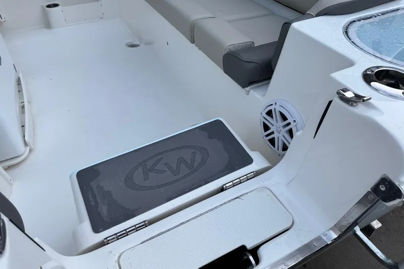 Slide: The Image of 2026 Key West 263 FS boat interior with seating and speaker detail. - 8