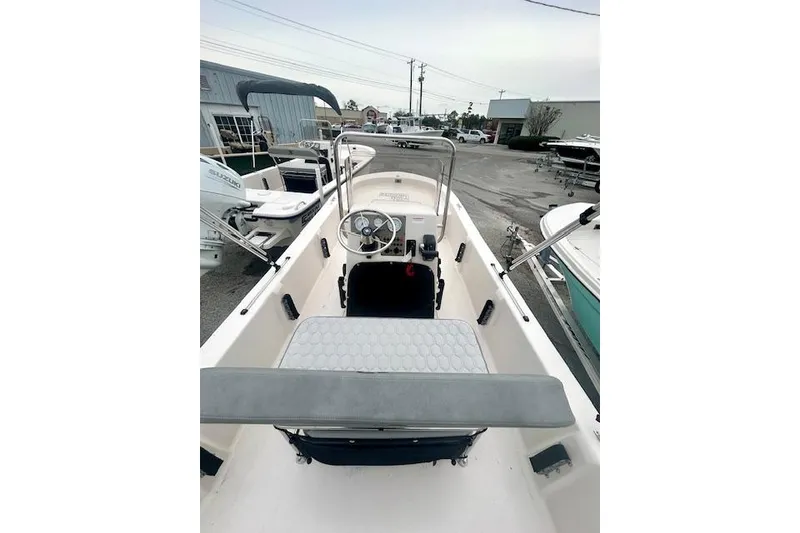 Slide: The Image of 2026 Carolina Skiff E20 JVX CC boat interior with steering console and seating. - 5