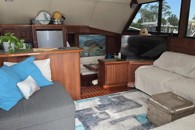 Slide: The Image of Cozy interior of 1989 Viking 45 Convertible yacht with modern decor and seating area. - 21