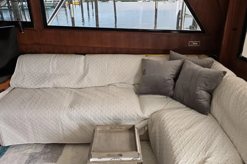 Slide: The Image of Interior of 1989 Viking 45 Convertible yacht with cozy sofa and pillows. - 22