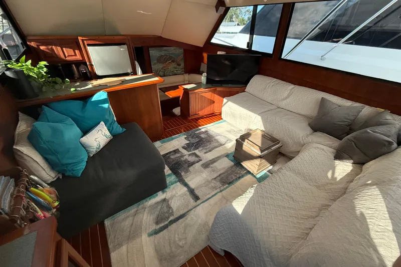 Slide: The Image of Luxurious interior of 1989 Viking 45 Convertible yacht with cozy seating and modern decor. - 24