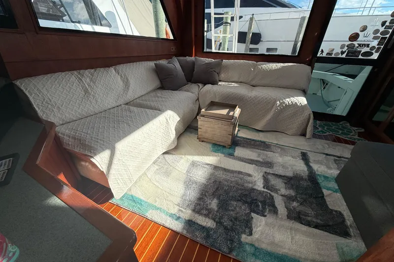 Slide: The Image of Luxurious interior of 1989 Viking 45 Convertible yacht with cozy seating and modern decor. - 27