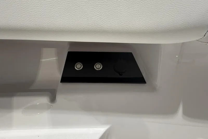 Slide: The Image of Control panel on 2025 Sportsman Open 322 Center Console boat interior. - 16