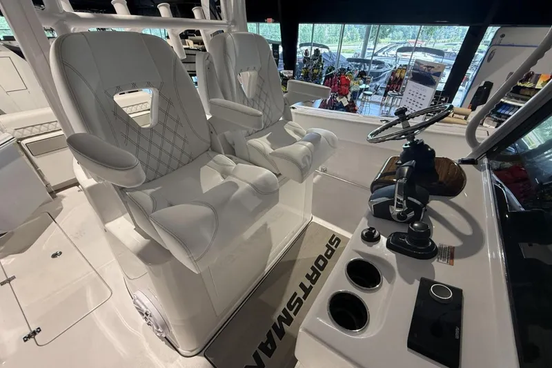 Slide: The Image of 2025 Sportsman Open 322 Center Console with luxurious seating and modern helm controls. - 23