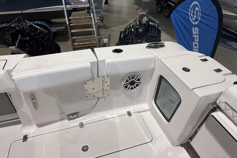 Slide: The Image of 2025 Sportsman Open 322 Center Console boat interior with seating and speaker. - 7
