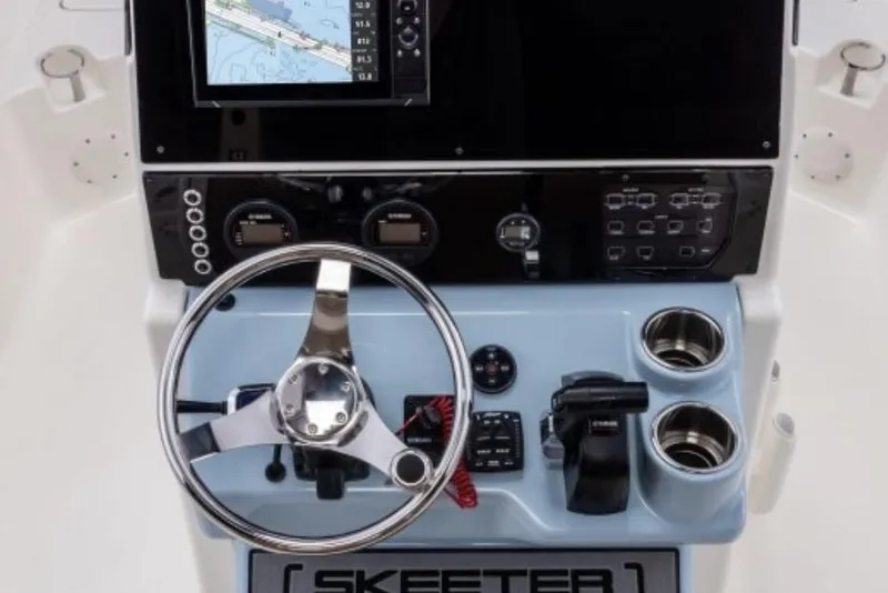 Slide: The Image of Manufacturer Provided Image: 2026 Skeeter SX2350 boat console with steering wheel, navigation screen, and controls. - 8