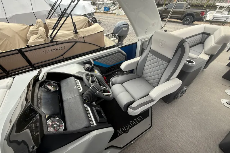 Slide: The Image of 2023 Godfrey AquaPatio 255 ULC pontoon boat with spacious seating and modern design. - 17