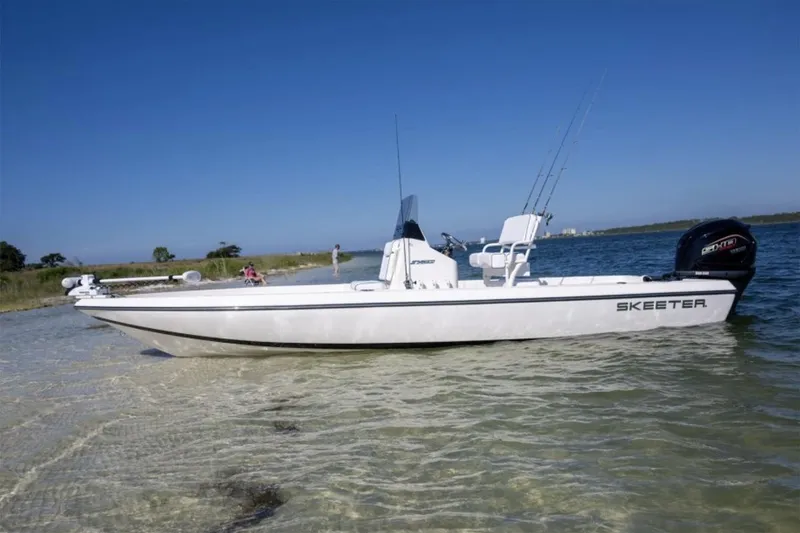 Slide: The Image of 2026 Skeeter SX230 boat on trailer, featuring sleek design and Yamaha engine. - 1