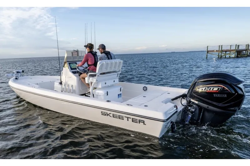 Slide: The Image of 2026 Skeeter SX230 boat with powerful 300 V6 engine, parked outdoors. - 2