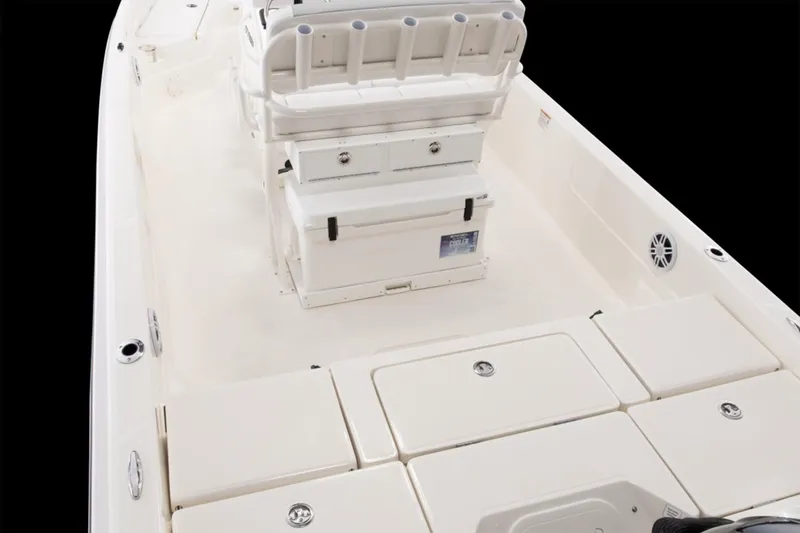 Slide: The Image of Manufacturer Provided Image: 2026 Skeeter SX230 boat docked on a sandy shore under a clear blue sky. - 5