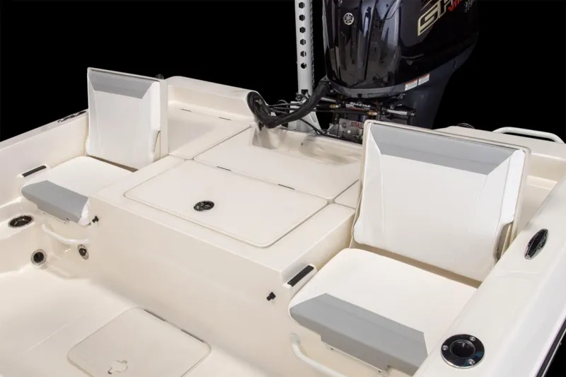 Slide: The Image of Manufacturer Provided Image: 2026 Skeeter SX230 boat cruising on open water with two passengers. - 6