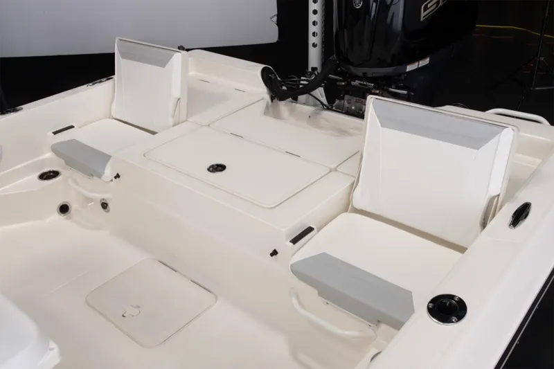 Slide: The Image of Manufacturer Provided Image: 2026 Skeeter SX230 boat dashboard with steering wheel, touchscreen display, and control panel. - 7