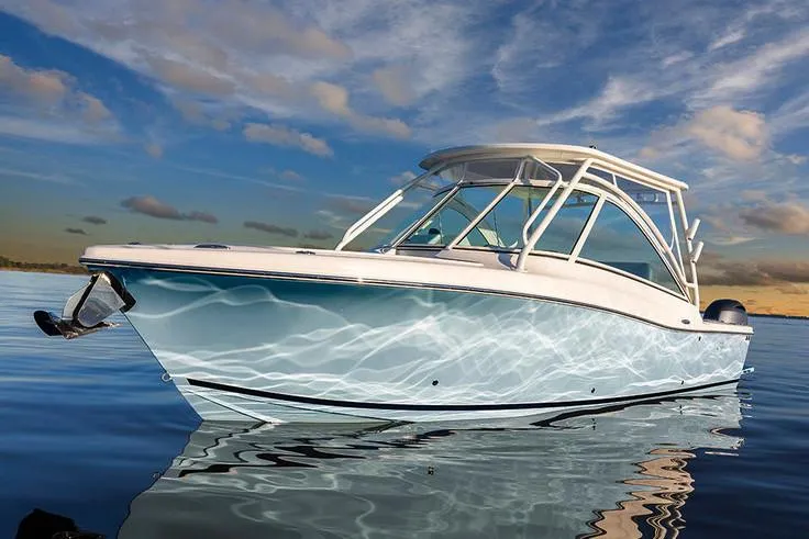 Slide: The Image of 2026 Albemarle 27 Dual Console boat on trailer with Yamaha engine, parked outdoors. - 2