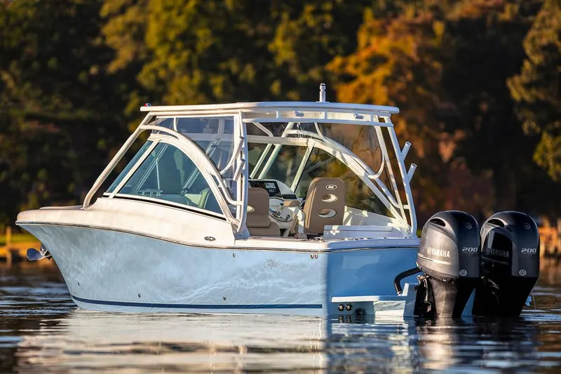 Slide: The Image of 2026 Albemarle 27 Dual Console boat on trailer, parked outdoors under a cloudy sky. - 5
