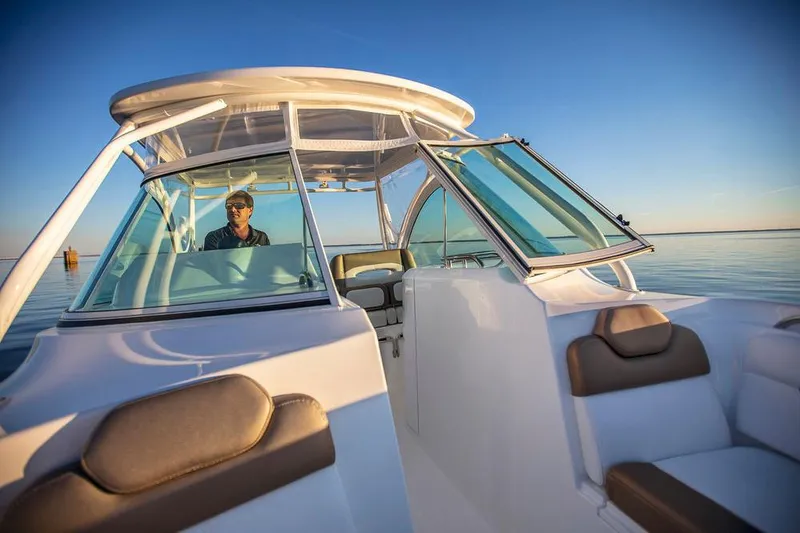 Slide: The Image of 2026 Albemarle 27 Dual Console boat interior with modern seating and dashboard. - 9