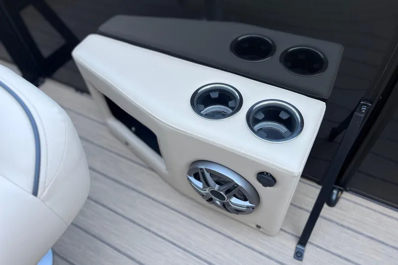 Slide: The Image of Cup holders and speaker on 2026 Godfrey SWEETWATER 2286 SFL boat interior. - 20