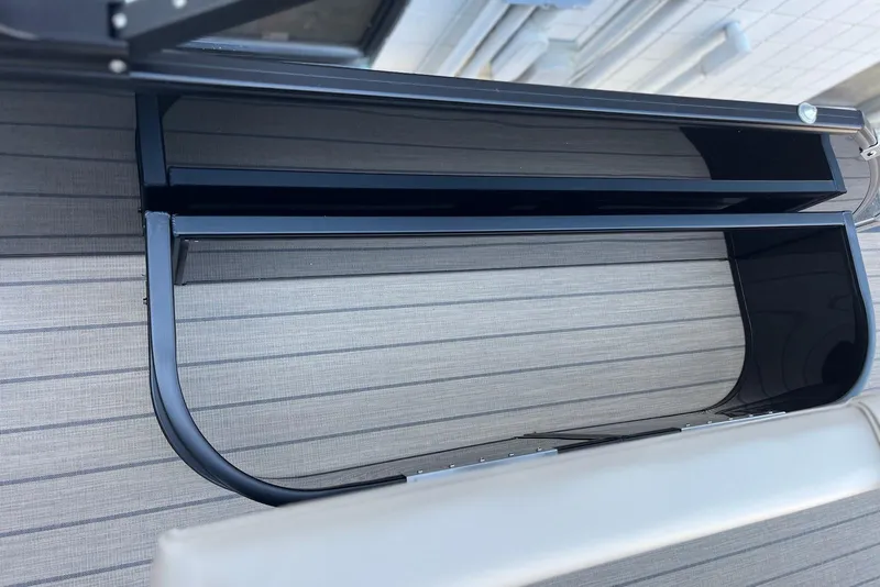 Slide: The Image of 2026 Godfrey SWEETWATER 2286 SFL boat interior with sleek black railing design. - 22