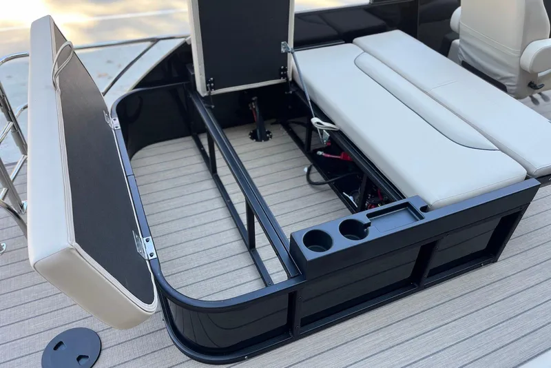 Slide: The Image of 2026 Godfrey SWEETWATER 2286 SFL boat interior with open storage and seating. - 31