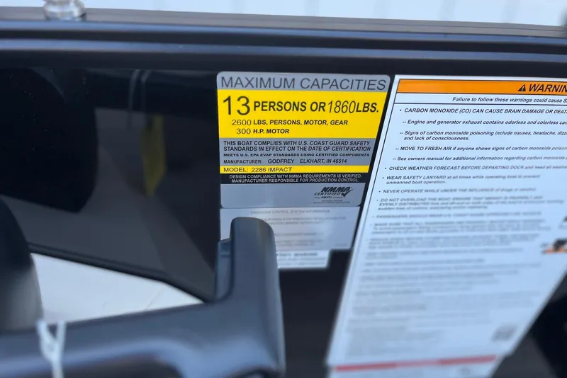 Slide: The Image of Maximum capacity label on 2026 Godfrey SWEETWATER 2286 SFL boat, 13 persons or 1860 lbs. - 34
